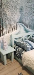a childs room with a snow covered wall at Kvitkovyi Rai in Slavske