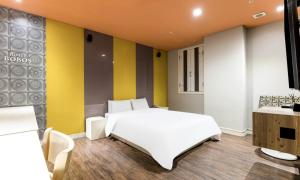 Postel nebo postele na pokoji v ubytování Dongtan BobosHotel