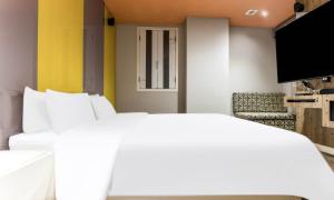 Postel nebo postele na pokoji v ubytování Dongtan BobosHotel