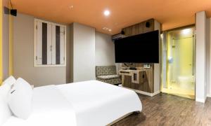 Postel nebo postele na pokoji v ubytování Dongtan BobosHotel