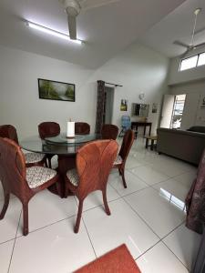 a dining room with a table and chairs at Dhuha Homestay in Kampong Kerubong