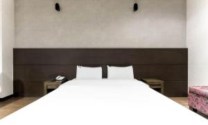 Postel nebo postele na pokoji v ubytování Dongtan BobosHotel