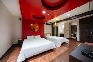 Postel nebo postele na pokoji v ubytování Dongtan BobosHotel