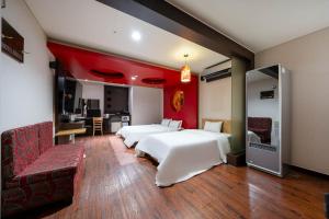 Postel nebo postele na pokoji v ubytování Dongtan BobosHotel
