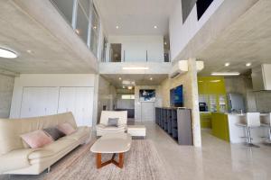 a living room with a couch and a table at Guest House Karst in Ufudo