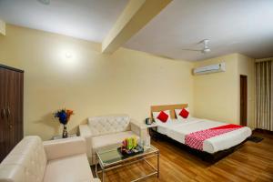 a hotel room with a bed and a couch at Super OYOHotel Silver Stay 02 in Jaipur