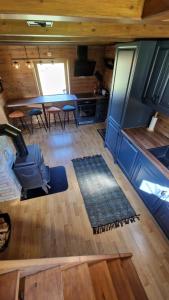 an aerial view of a kitchen and dining area of a tiny house at Haukland Panorama in Offersøya