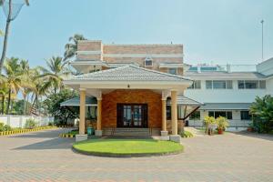 a building with a pavilion in front of it at Blue Waters Cherai in Cherai Beach