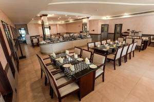 an overhead view of a restaurant with tables and chairs at Blue Waters Cherai in Cherai Beach