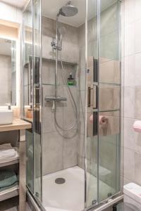 a shower with a glass door in a bathroom at studio Vieux Lyon in Lyon