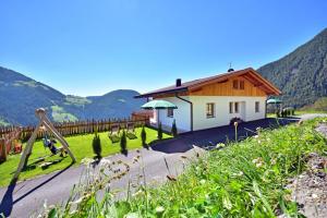 a house with a playground in the mountains at Tratterhof Apt Eidechsspitze in Vandoies