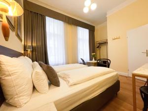 Letto o letti in una camera di Private Comfort STEPHANSPLATZ - SELF CHECK IN