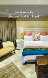 a bedroom with a bed and a couch and a table at Country Lane Farm lodge in Cradock
