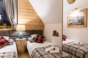 Posteľ alebo postele v izbe v ubytovaní Apartament Marmot Deluxe Zakopane