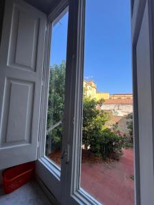 an open door with a view of a balcony at Monastero Flat in Naples