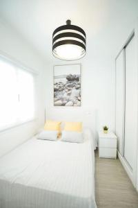 Ένα ή περισσότερα κρεβάτια σε δωμάτιο στο Luxury Solarium, Jacuzzi, A/C and Wi-fi