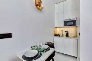 Kuhinja ili čajna kuhinja u objektu Apartment Bastille Le Marais by Studio prestige