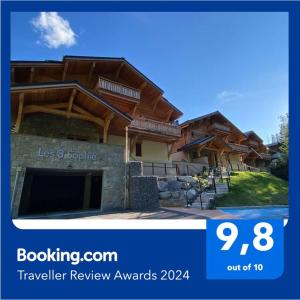 a picture of a house with a sign that says travel review awards at Gorgeous 2 bedroom, 2 full bath, ski in apartment! in Morzine