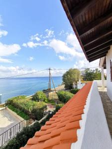 a view of the ocean from the balcony of a house at Villa Christina in Karfas