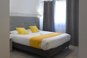 Postel nebo postele na pokoji v ubytování Hôtel A Madonetta