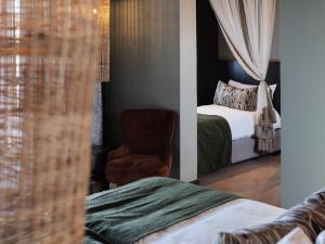Een bed of bedden in een kamer bij Lodge Damaraland