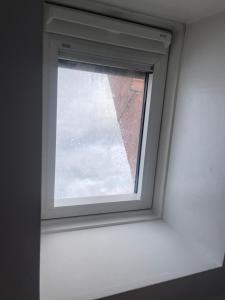 a window in a room with snow on it at Spielwarenmesse Unterkunft in Nuremberg