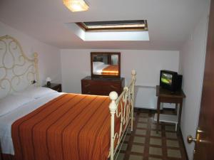Letto o letti in una camera di Albergo Natucci