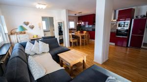 a living room with a couch and a table at Ferienwohnung Hochtal in Bernau im Schwarzwald