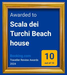 a framed sign for a beach house at Scala dei Turchi Beach house in Realmonte