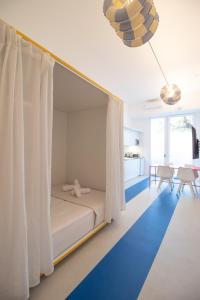 a bedroom with a bed with a canopy at Marino by Clink in Valencia