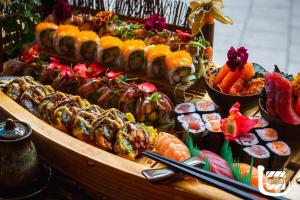 a buffet filled with different types of food on a table at Hotel Denbu in Hamburg
