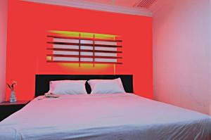 Ein Bett oder Betten in einem Zimmer der Unterkunft Hotel China Town 2
