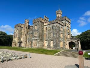 an old castle with some stairs in front of it at Dog friendly 6- Bedroom House in Isle of Lewis - great for families and large groups in Garrabost