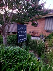 a sign for a hunter coffee restaurant in front of a building at Hunter Cottage Euroa in Euroa