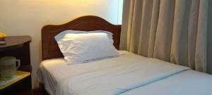 Ein Bett oder Betten in einem Zimmer der Unterkunft Hotel China Town 2