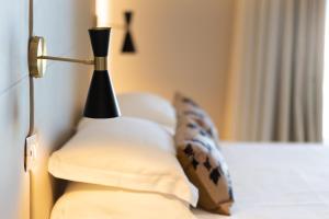 A bed or beds in a room at Hotel Mondial