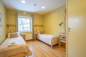 Postel nebo postele na pokoji v ubytování Kongo Hotel