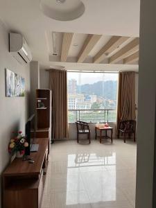 a living room with a view of a building at Thiên Thiên Thanh in Lao Cai