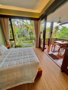 Postel nebo postele na pokoji v ubytování Ardan Maison Ubud
