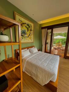 Postel nebo postele na pokoji v ubytování Ardan Maison Ubud
