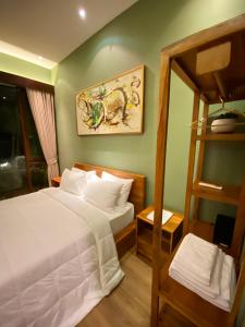 Postel nebo postele na pokoji v ubytování Ardan Maison Ubud