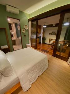 Postel nebo postele na pokoji v ubytování Ardan Maison Ubud