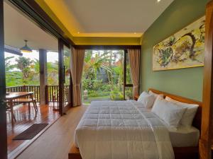 Postel nebo postele na pokoji v ubytování Ardan Maison Ubud