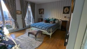 מיטה או מיטות בחדר ב-Chambre d'Hôtes La Grenade Bleue