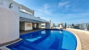 a swimming pool on the roof of a building at Zapbed House- AWP 2605 in Dubai