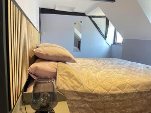 a bedroom with a bed with a yellow blanket at Cathedral View Apartment, Flat 4 in Bury Saint Edmunds