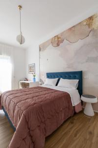 Posteľ alebo postele v izbe v ubytovaní Cas’ A Mare - Beachfront Luxury Suites
