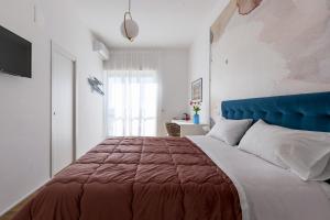 Posteľ alebo postele v izbe v ubytovaní Cas’ A Mare - Beachfront Luxury Suites
