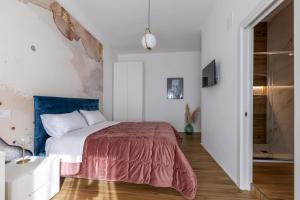 Posteľ alebo postele v izbe v ubytovaní Cas’ A Mare - Beachfront Luxury Suites