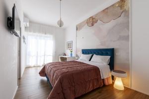 Posteľ alebo postele v izbe v ubytovaní Cas’ A Mare - Beachfront Luxury Suites